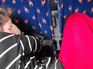 The "proper" way to sleep on the bus.