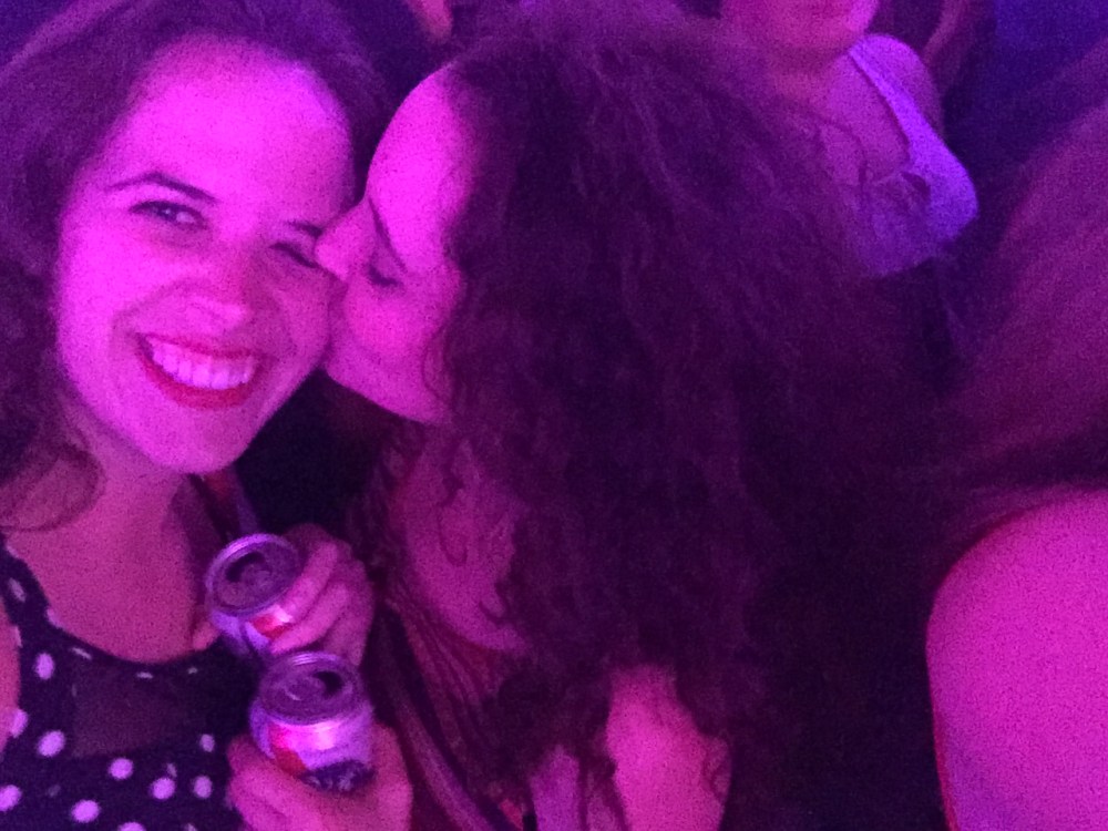 Jacqueline kissing my cheek under the lovely glow at Mike Talayna's in June.